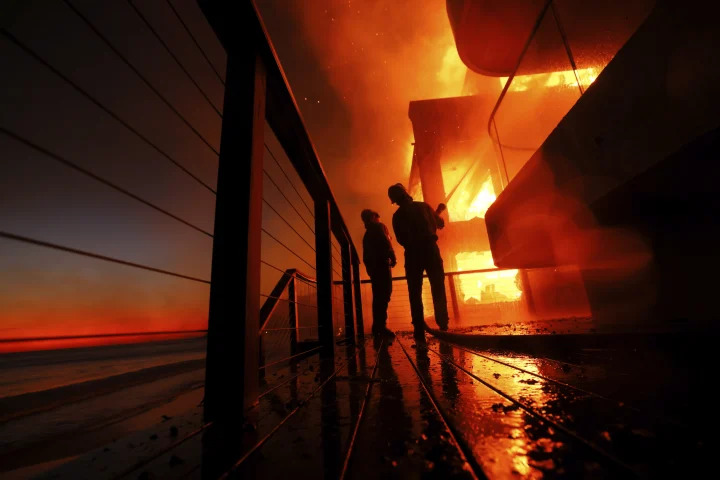 Out-of-control Los Angeles wildfires burn thousands of homes and other structures