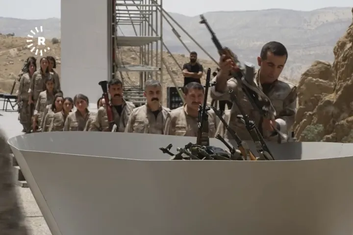 Kurdish separatist fighters in Iraq begin laying down weapons as part of peace process with Turkey