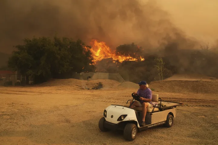 Fast-growing brush fire forces thousands to evacuate north of Los Angeles